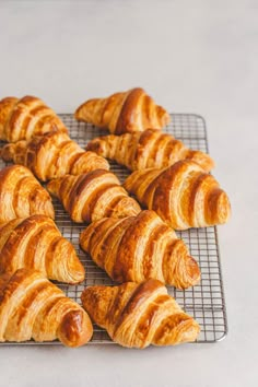 there are many croissants on the cooling rack