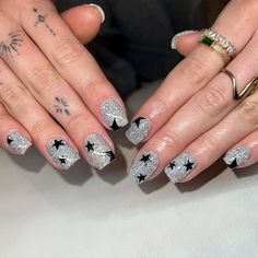 16. Glitzy Silver and Black with Star Accents Glitter Tips, Long Almond Nails, Navy Nails, Glitter French Tips, Fireworks Design, Silver Ombre, White Glitter Nails, Pointed Nails, Golden Glitter