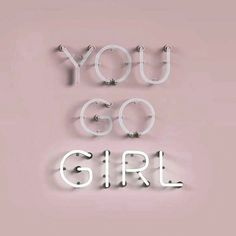 the words you go girl written in neon letters on a pink background with white lights