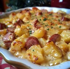 a casserole dish with sausage and potatoes