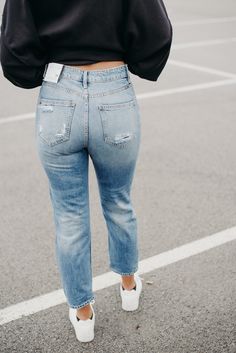 The trendiest denim of the season! These high rise true denim mom jeans can’t be passed up. They hug in all of the right places while still offering the stylish boyfriend look. These jeans can be worn casually with sneakers and flip flops or dress them up with a blazer and chic heel. Either way, you can’t go wrong. They have an 11” rise and an 25” inseam, we do recommend sizing one size up in this pair of jeans due to lack of stretch in material. 100% Cotton Heavily distressed Model:Karli is 5ft Boyfriend Look, Chic Heels, Trendy Denim, Everyday Chic, Mom Jean, Boutique Design, Bottom Clothes, Chic Boutique, Mom Jeans