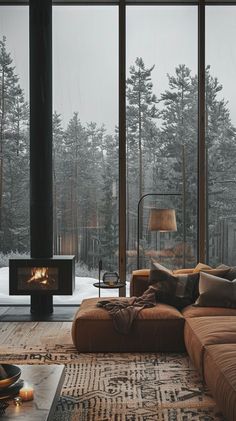 a living room filled with furniture and a fire place in the middle of a forest