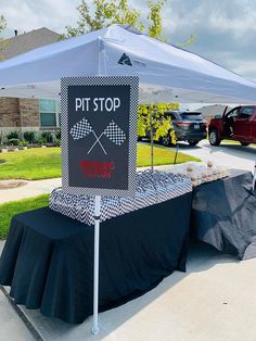 a table with a sign that says pit stop