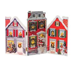 three paper houses with christmas decorations on the front and back sides, one in red