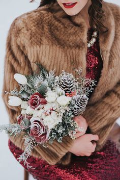 a woman in a fur coat holding a bouquet