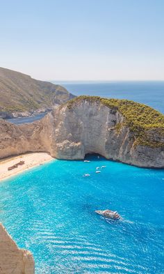 an aerial view of the blue water and cliffs