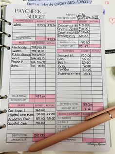 a pink and white checkbook next to a pen on top of a table with other items Budgeting Notebook Ideas, Diy Budget Planner Notebook, Paycheck Tracker, Biweekly Budget, Budget Planner Book, Budget By Paycheck, Monthly Budget Planning, Saving Money Chart, Weekly Budget Planner