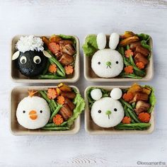 four small trays with food shaped like animals