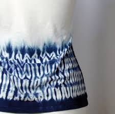 a woman's blue and white tie - dyed skirt on a mannequin