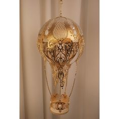 an ornate light fixture hanging from a ceiling