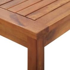 a close up view of a wooden table with slats on it's sides