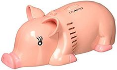 a pink pig shaped money box sitting on top of a white surface