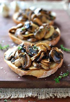 two pieces of bread with mushrooms on it