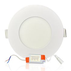 a white downlight with an orange cord attached to it's side and two wires running through the middle