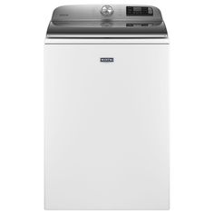 a white dishwasher sitting on top of a white countertop next to a dryer