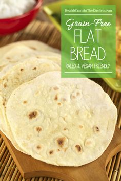 three flat breads sitting on top of a wooden cutting board