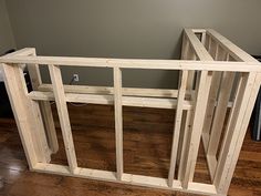 a wooden frame sitting on top of a hard wood floor