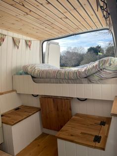 there is a bunk bed in the back of this camper with stairs leading up to it