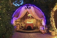 an outdoor gazebo decorated with fairy lights