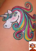 a woman's stomach with an image of a unicorn painted on it