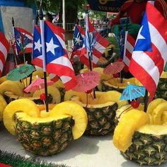 pineapples with flags and umbrellas are on display