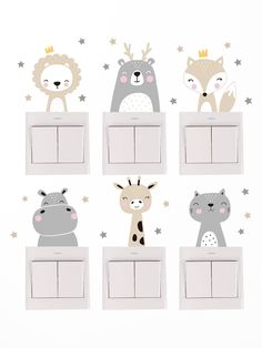 four light switch covers with animals and stars on the wall behind them, one has a crown