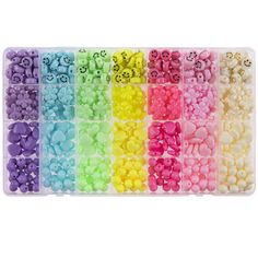 a box filled with lots of different colors of beads and skulls on it's side