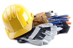 construction equipment including gloves and safety helmet on white background with clippings for text