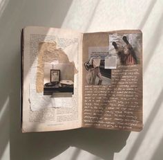 an open book with pictures and writing on it