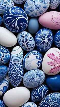 many different colored easter eggs with designs on them, all in blue and white colors