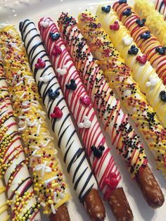 a white plate topped with lots of different types of donuts