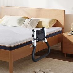 a bed is shown with an adjustable headboard and foot board attached to the frame