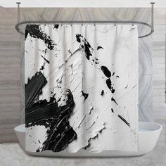 a shower curtain with black and white paint splattered on it