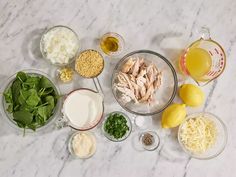 the ingredients are laid out on the table to make this meal, including chicken and spinach