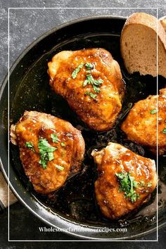 chicken in a skillet with bread and parsley