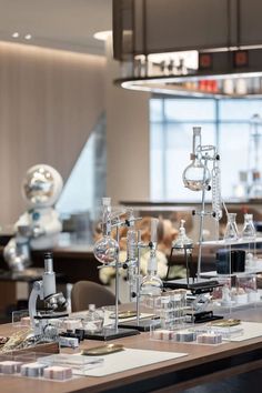 a lab filled with lots of different types of laboratory equipment on top of a wooden table