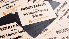 several business cards on top of each other with the words proud parent and school logo