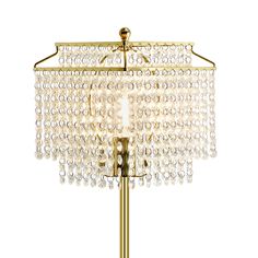 a gold table lamp with crystal beads on it