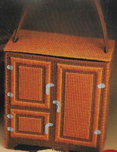 an orange basket sitting on top of a table