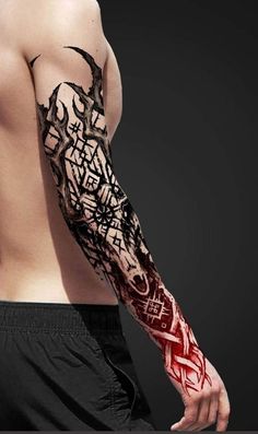 a man's arm covered in black and red ink with an intricate design on it