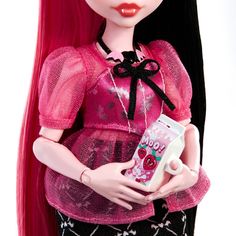 a doll with long red hair holding a cell phone and wearing a pink dress that says boo boo