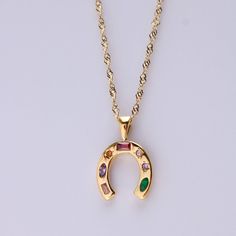 Discover our enchanting Lucky Horseshoe Necklaces, featuring 7 colorful Cubic Zirconia stones. Embrace good fortune and vibrant style with these unique accessories. Product Details Size: 40+6CM 18K Gold Plated /Stainless SteelWater-Resistant HypoallergenicDurable Horseshoe Necklace, Vibrant Style, Lucky Horseshoe, Unique Accessories, Gem Necklace, Cotton Ball, Good Fortune, Accessories Unique, Jewelry Plate