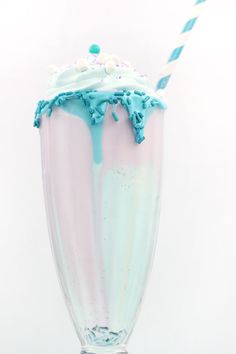 there is a blue and white milkshake with sprinkles on it