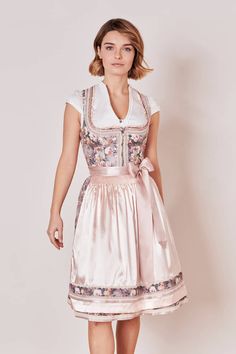 Description ITEM DESCRIPTION The Dirndl Selma impresses with its lovely vintage look. A fine floral pattern adorns the dress and is rounded off by a fine apron. The model is 1.70m tall and is wearing the dirndl with a skirt length of 60cm in this photo. DETAILS & EXTRAS Detail straight neckline Color pink Item No. 047456-0-0233 Bags One pocket in the skirt Clasp Front zip fastening WHICH SKIRT LENGTH SUITS ME? MATERIAL & CARE Material General 65% polyamide, 35% cotton Material lining 95% polyest Dirndl Pattern, Wedding Dirndl, Dirndl Blouse, Swimwear Accessories, Petticoat, Vintage Look, Skirt Length, Sweater Jacket, Vintage Looks