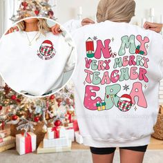 "Christmas Teacher Sweatshirt, Very Merry Teacher Shirt, Custom Teacher Christmas Era, Retro Xmas Teacher Sweatshirt, Teacher Christmas Gift ↓ Click here to view our additional fashionable collections ↓ https://handcraftedbyhelenn.etsy.com Product Details: - 100% Cotton (fiber content may vary for different colors) - Medium fabric (5.3 oz/yd2 (180 g/m2)) - Classic fit - Tear away label - Runs true to size Care instructions: - Machine wash: warm (max 40C or 105F); - Non-chlorine: bleach as needed Cute Teacher Shirts Winter, Teacher Shirt Christmas, Cute Teacher Christmas Shirts, Cute Teacher Shirts Christmas, Christmas Teacher Shirts Vinyl, Christmas Teacher Shirts, Teacher Christmas Shirts, Christmad Teacher Shirts, Pj Day