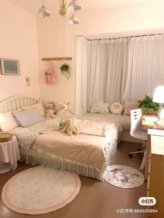 a bedroom with two beds, a desk and rugs on the floor in front of windows