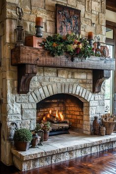 a stone fireplace with potted plants and candles