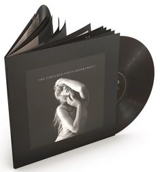 an album is opened to show the cover art for the song's first album