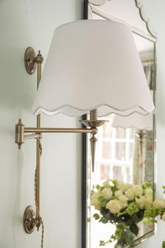 a lamp that is next to a mirror