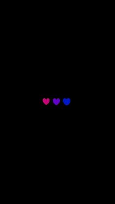 three hearts in the dark with one red and one blue heart on it's left side